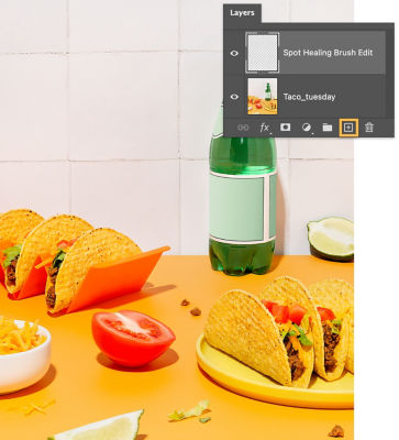 The Spot Healing Brush Edit layer is selected and the add layer icon, located in the bottom of the Layers panel, is highlighted.